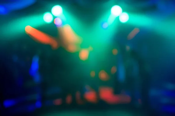 Fondo abstracto borroso de luces de colores en el club nocturno — Foto de Stock