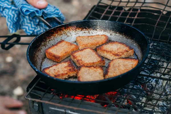 Toast bread roasting on fire camping in the nature — Stock Photo, Image