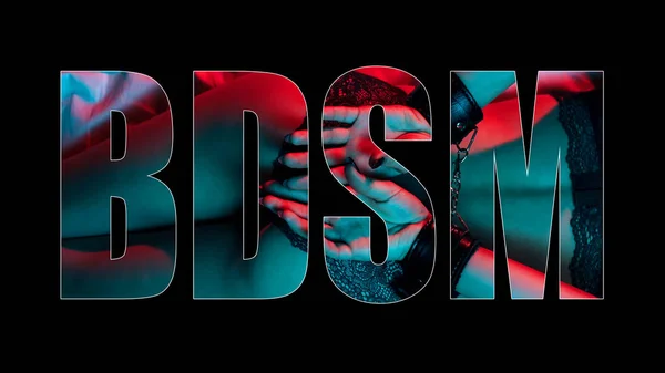 Creative BDSM lettering on a black background. Sexy ass girl with hands in leather handcuffs for BDSM sex — 스톡 사진