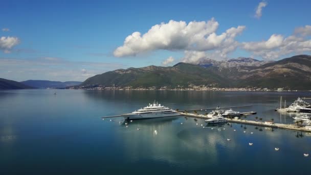 Aerial view on yacht club. White boats are in blue sea water. — Stock Video