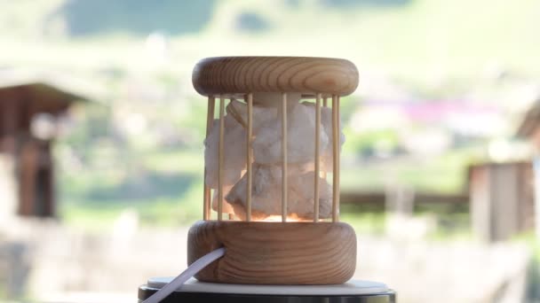 Decorative night lamp and stones crystal. beautiful mystical composition with quartz crystal on a larch wood stand — Stockvideo