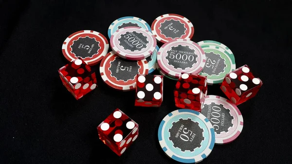 The red dices and stacked of chips bet many value