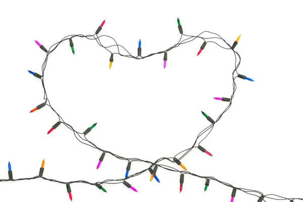 Coração com luzes de Natal no fundo branco — Fotografia de Stock