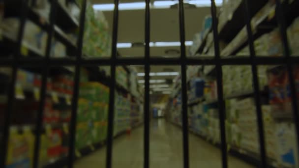 Subjective POV from inside cart as it moves through a supermarket aisle — Stock Video
