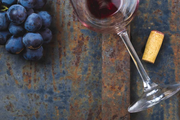 Wine concept - wine, grape on rustik dark background. top view