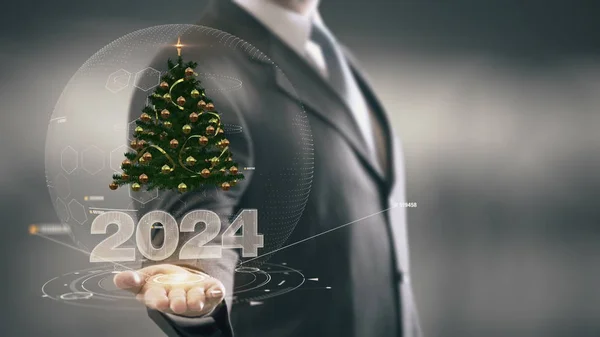 2024 Різдвяна ялинка Бізнесмен тримає в руці Нові технології — стокове фото