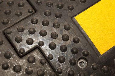 Components of artificial roughness made of black rubber with a relief coating for better close-up grip clipart