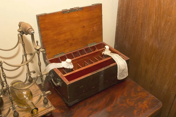 Ancient wooden box with cells for medicines and a bottle stand — 스톡 사진