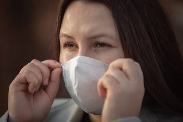 Stop the infection, woman wearing medical mask on the street protection against virus, concept of pollution — 스톡 사진