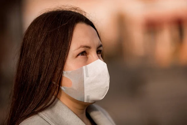 Stop the infection, woman wearing medical mask on the street protection against virus, concept of pollution — 스톡 사진