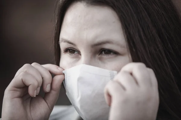 Stop the infection, woman wearing medical mask on the street protection against virus, concept of pollution — 스톡 사진