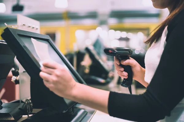 Young woman hands scaning, entering discount, sale on a receipt, touchscreen cash register, POS, finance concept — Stock Photo, Image