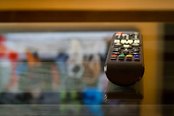 TV television remote on the glass table, ready for watching film or serial