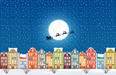 Noel Baba Noel arifesi bir şekilde dekore edilmiş karlı eski şehir şehir uçar.