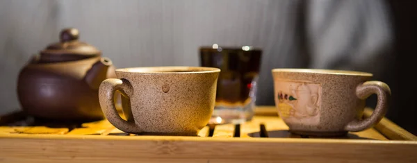 Tea drinking. Evening. Puer. Tea desk. Cups.