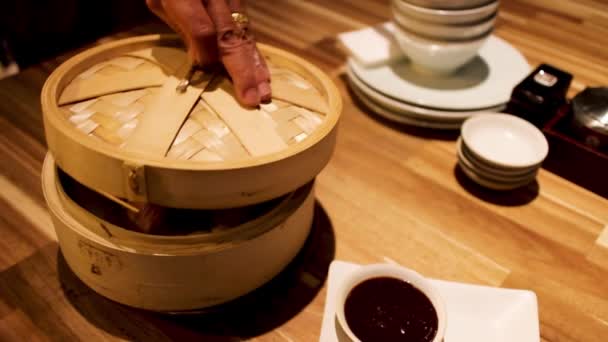 Colorful steam dimsum close up inside the wooden box in Chinese restaurant — Stock Video