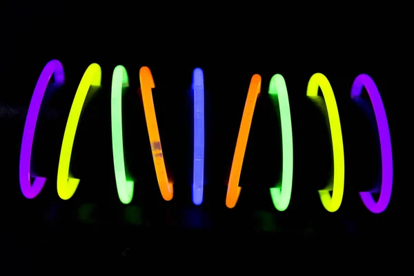 Bracelets made with glow sticks fluorescent lights — Stock Photo, Image