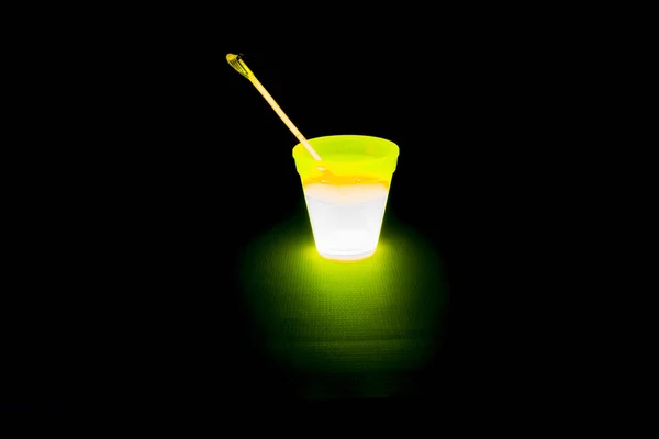 Yellow colored fluorescent glass with glow sticks lights