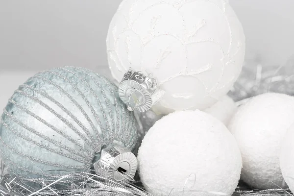 silver and white christmas ornament decorated balls close up
