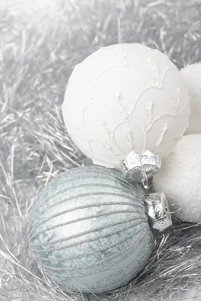 silver and white christmas ornament decorated balls close up