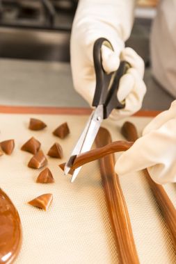 Artisanal production of caramel sweets butterscotch candies clipart