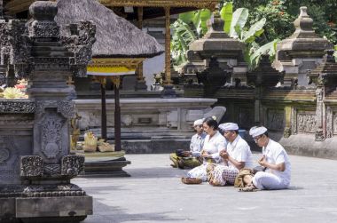 Documentary editorial image. People praying in the temple, religion hinduism Buddhism, Bali. Indonesia clipart