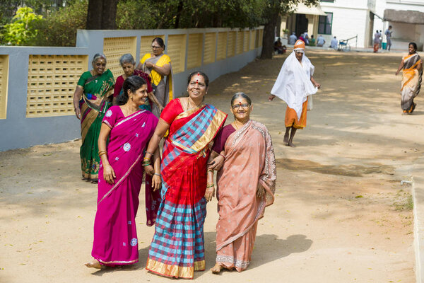 Documentary editorial. Ashram of Sri Ramana Maharshi, Tiruvannamalai, Tamil Nadu, India - March circa, 2018. Unidentified woman and man and children in the ashram area to meditate, pray, spirituality.