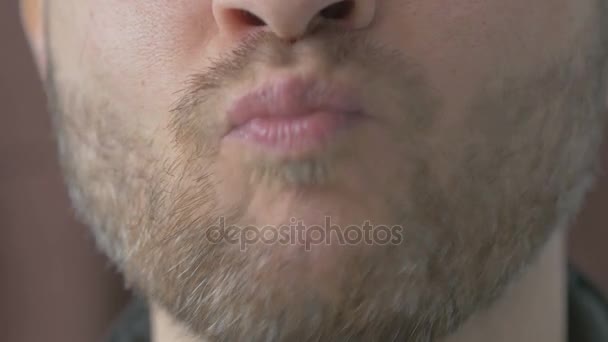 Close up of unshaven man eating an Apple — Stock Video