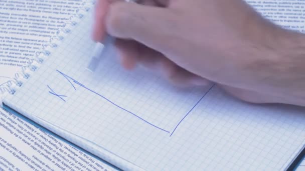 Male hand is writing in business document lying on the table. Close-up. — Stock Video