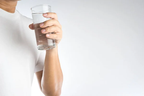 Hand holding a glass of water — Stock Photo, Image