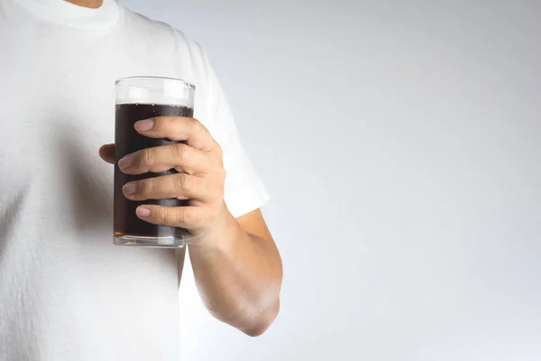 Hand holding a glass of soda water — Stock Photo, Image