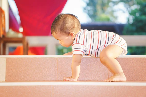 10 months adorable Asian baby climbing down stairs — Stock Photo, Image