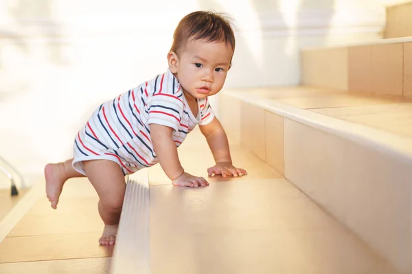 10 months adorable Asian baby climbing down stairs — Stock Photo, Image