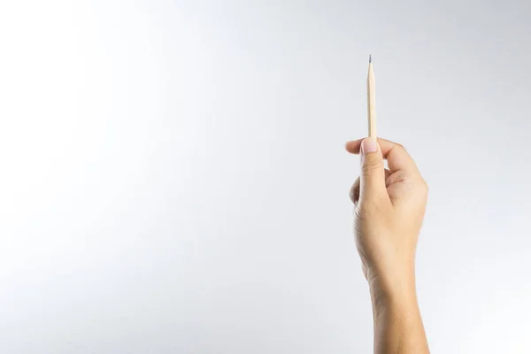 Rechte Hand hält einen Bleistift — Stockfoto
