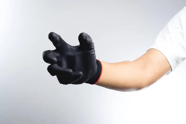 Eine Hand mit schwarzem Handschuh — Stockfoto