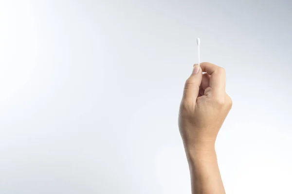 Hand with cotton swab — Stock Photo, Image