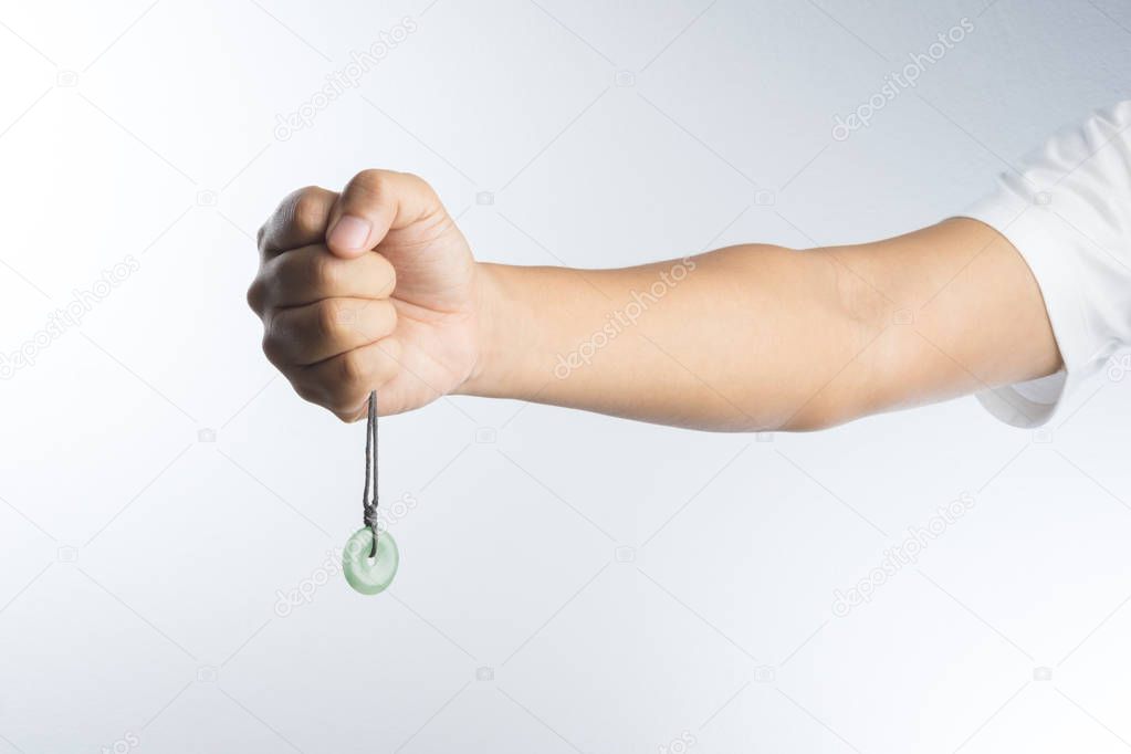 hand with jade necklace