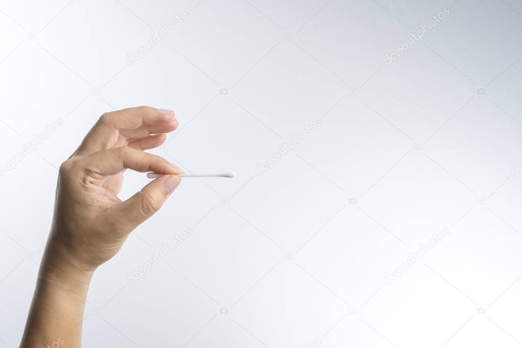 Hand with cotton swab