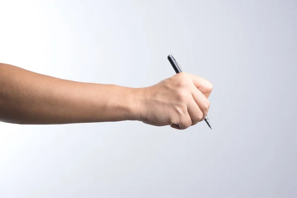 Hand hält einen Stift zum Unterschreiben oder Schreiben — Stockfoto