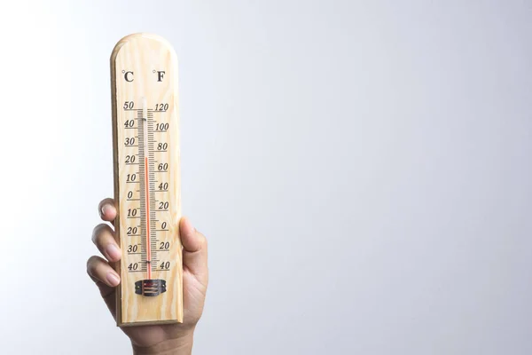 Hand holding classic thermometer — Stock Photo, Image