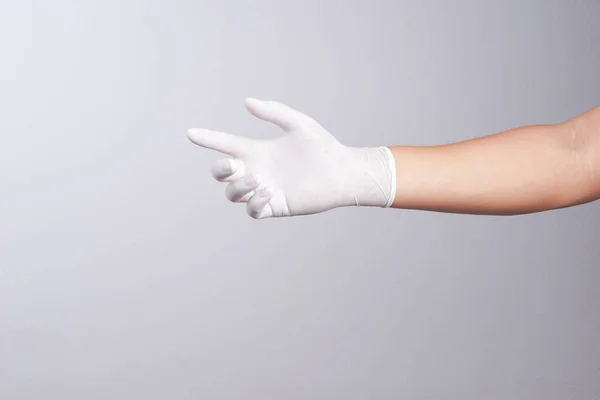 Ręka na sobie Rękawice gumowe — Zdjęcie stockowe