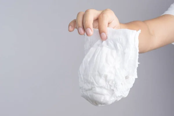 Hand holding used baby diaper — Stock Photo, Image