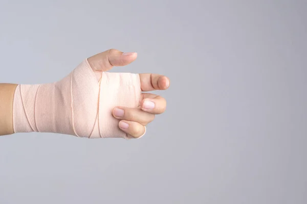 Hand with strapped bandage — Stock Photo, Image