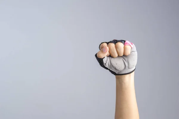 A hand wearing bicycle glove with clenched fist sign — Stock Photo, Image