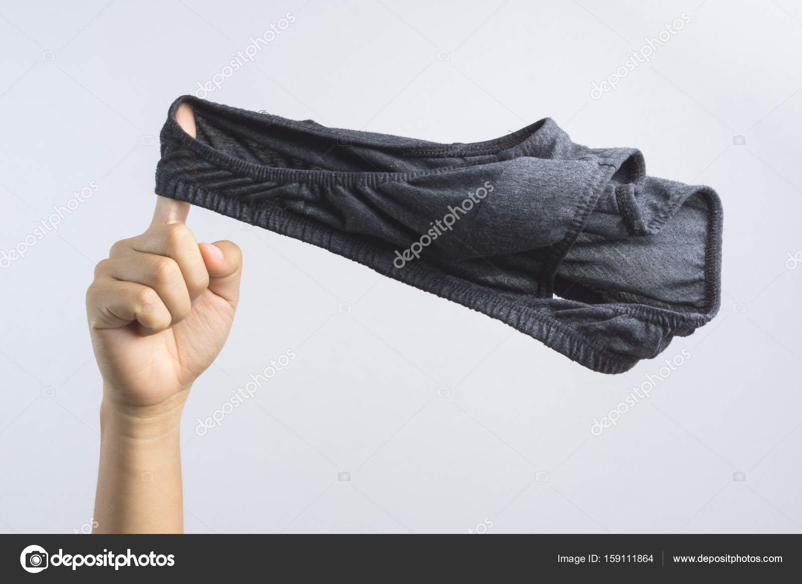 Hand holding man underwear or underpants for men Stock Photo by  ©BonNontawat 159111864