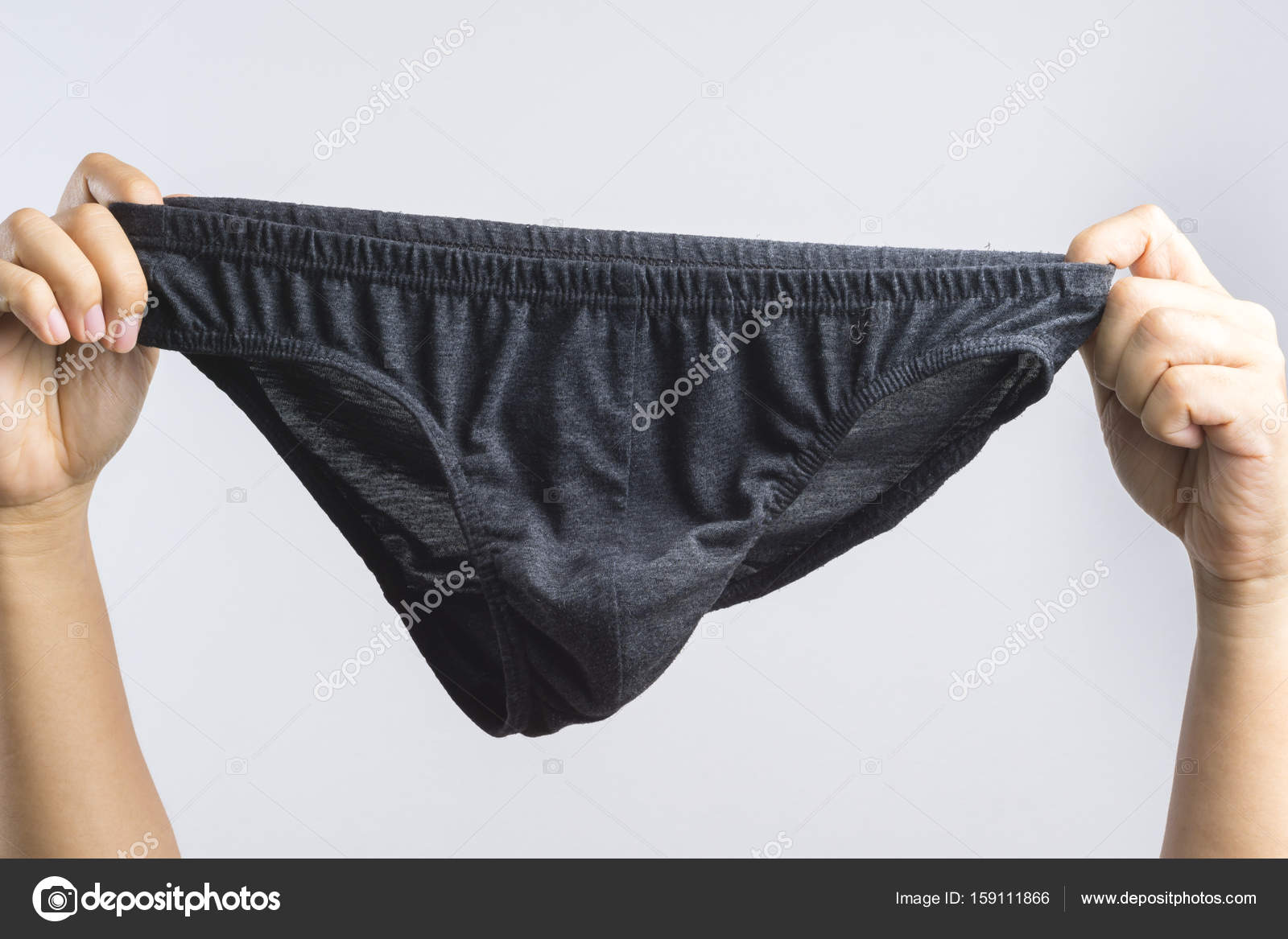 Hand holding man underwear or underpants for men Stock Photo by  ©BonNontawat 159111866