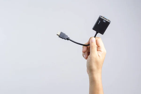 Hand holding adaptor HDMI to VGA cable connector — Stock Photo, Image