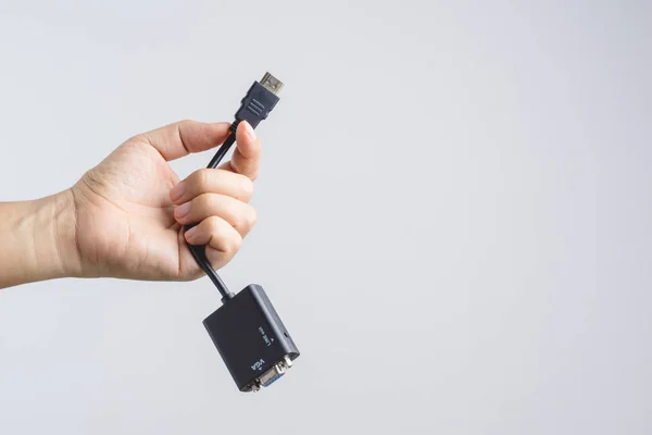 Hand holding adaptor HDMI to VGA cable connector — Stock Photo, Image