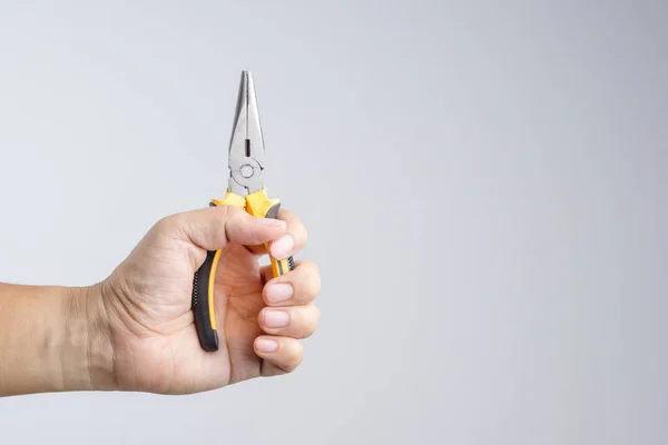 Hand Holding Needle Nose Pointy Pliers Universal Repair Construction White — Stock Photo, Image