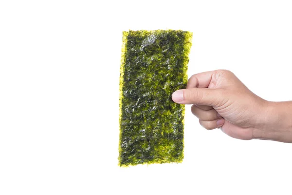 Mano sosteniendo Nori, hoja de algas secas, un bocadillo saludable —  Fotos de Stock